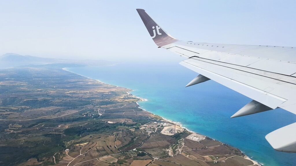 Plane flying over sea