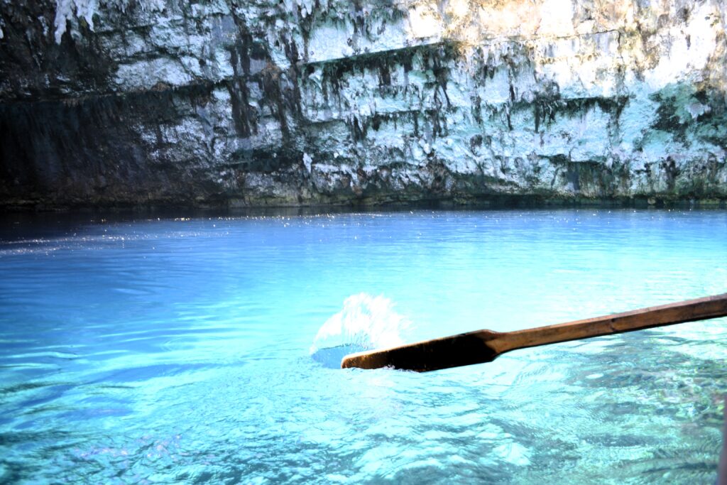 Melissani cave lake water while in the boat, one of the Top 5 attractions in Kefalonia