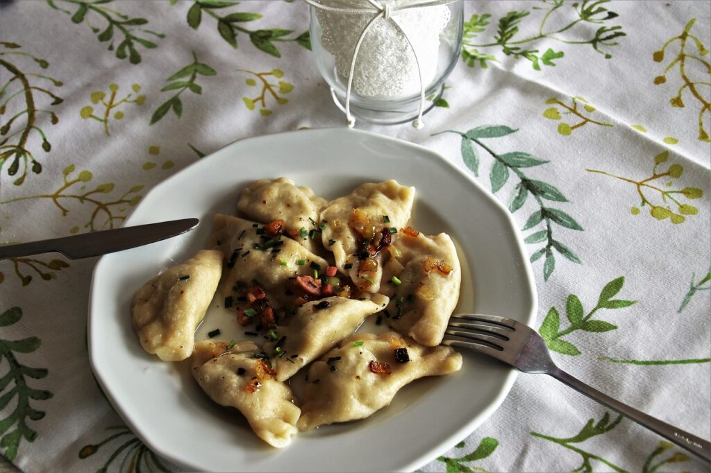 a plate of creamy pierogi, a typical food of poland