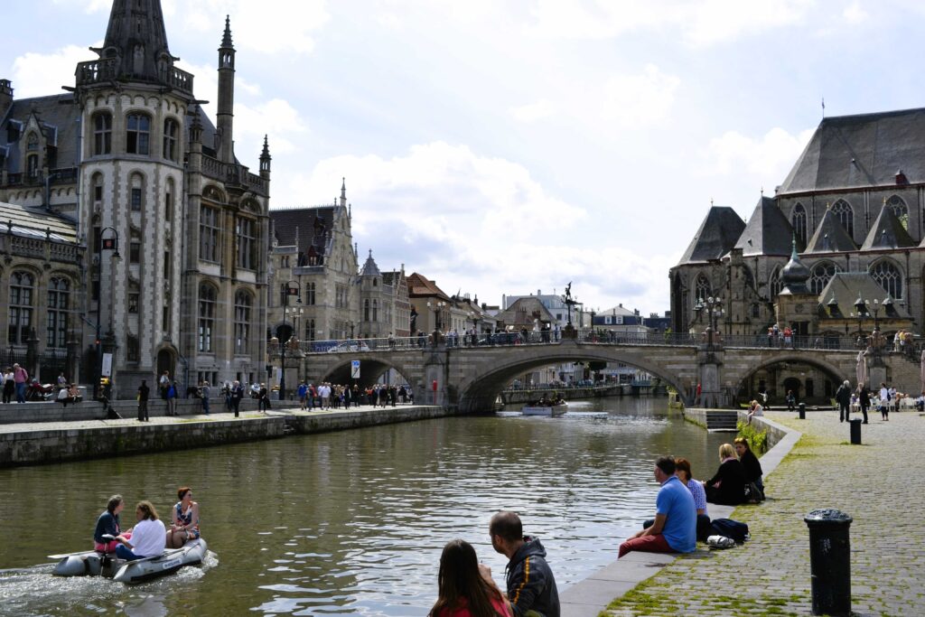 tourist relaxing on the graslei in ghent