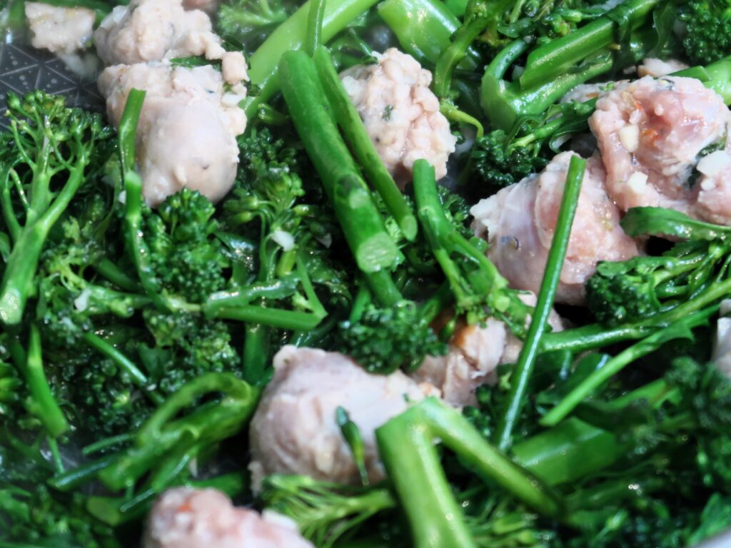 cooking off the broccolini with the sausage