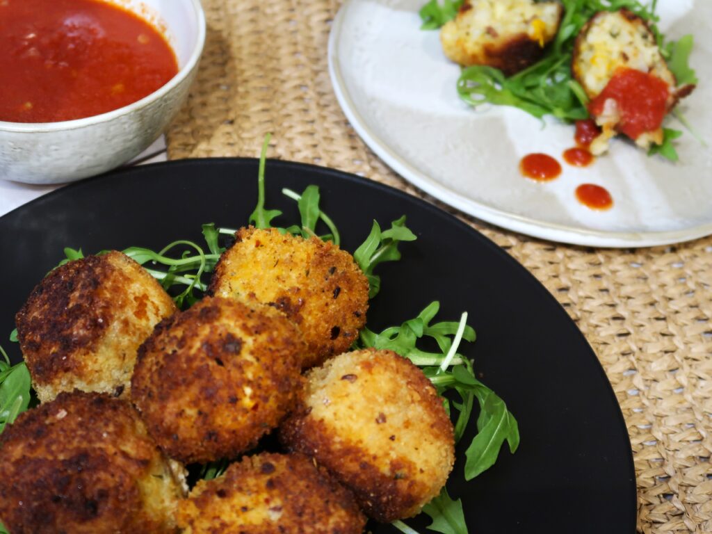 fried rice balls served with tomato chilli sauce