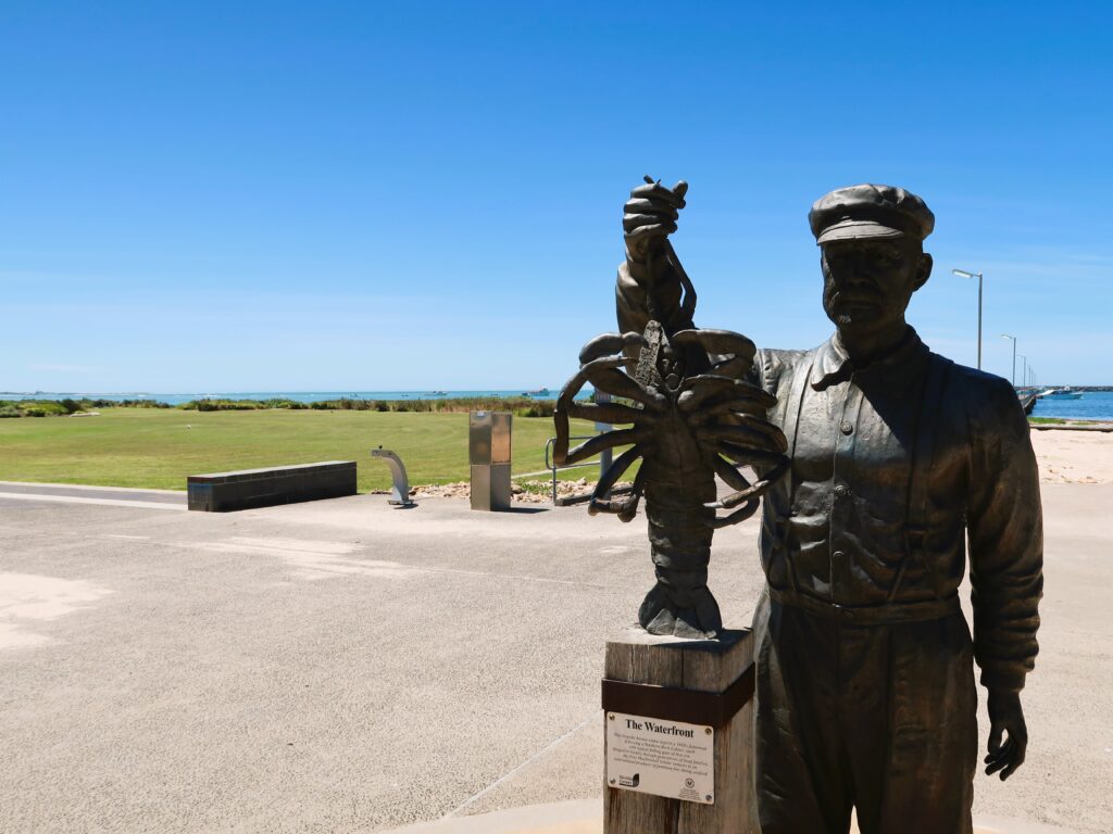 port macdonnell man holding lobster statue