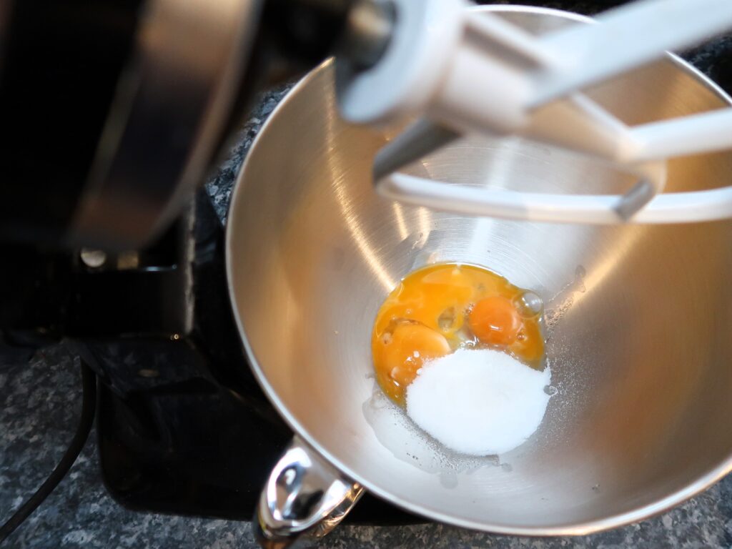 combining sugar and egg yolks