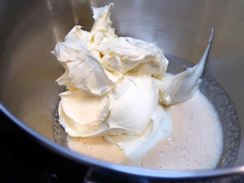 adding mascarpone to the cream for tiramisu